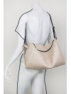 Beige perforated leather backpack