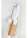 Straw and orange leather wrist bag